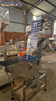 Alimentador posicionador abastecedor em aço inox de tampas Norma Alimentador posicionador abastecedor em aço inox de tampas Norma